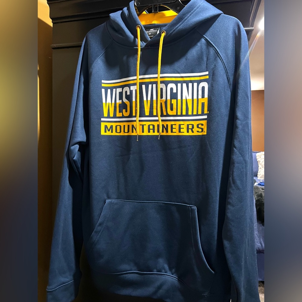 A blue WVU sports hoodie with yellow & white writing.